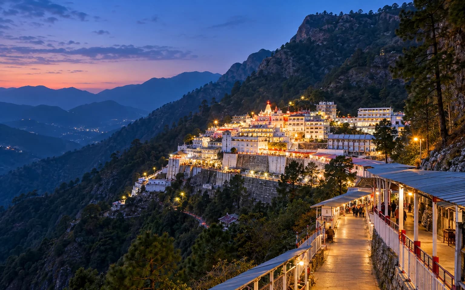 Vaishno Devi Bhawan illuminated at blue hour in the Trikuta hills