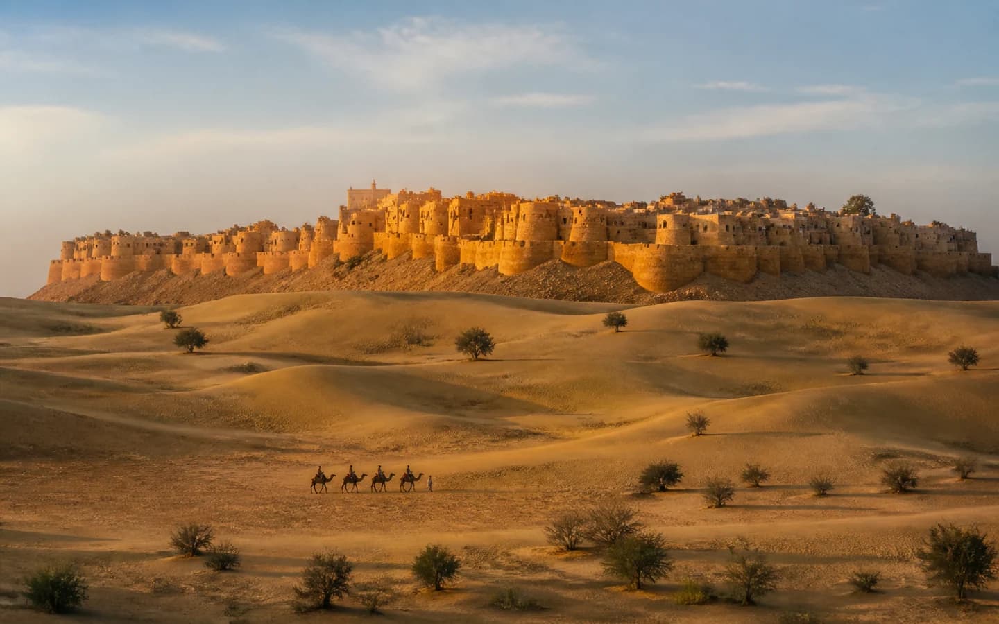 Golden Jaisalmer Fort rising beyond the dunes of the Thar Desert
