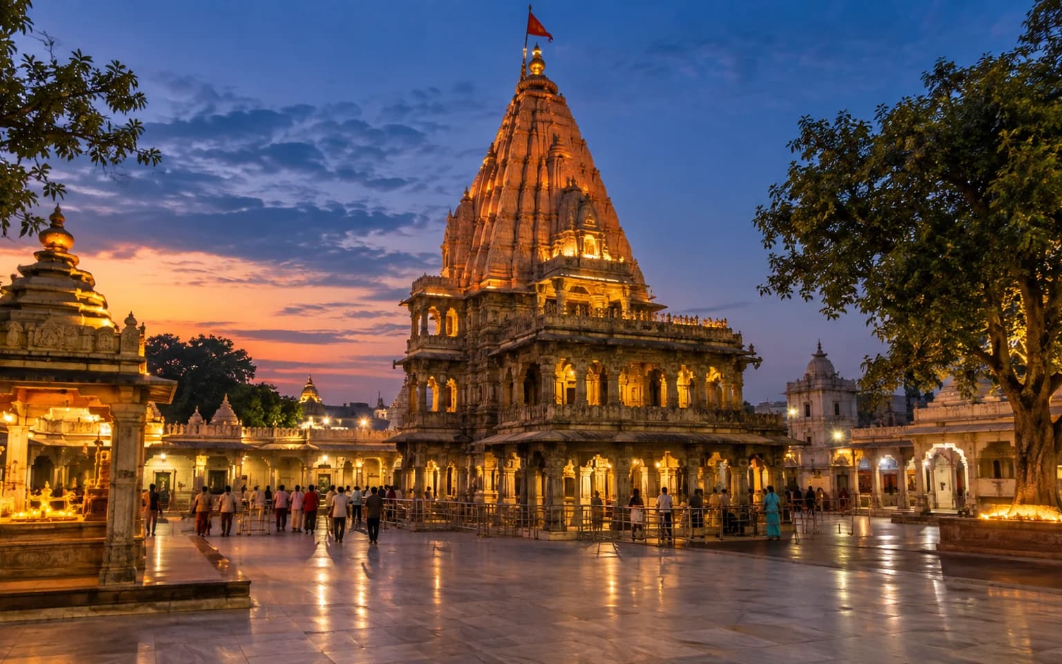 Illuminated Mahakaleshwar temple complex in Ujjain at blue hour